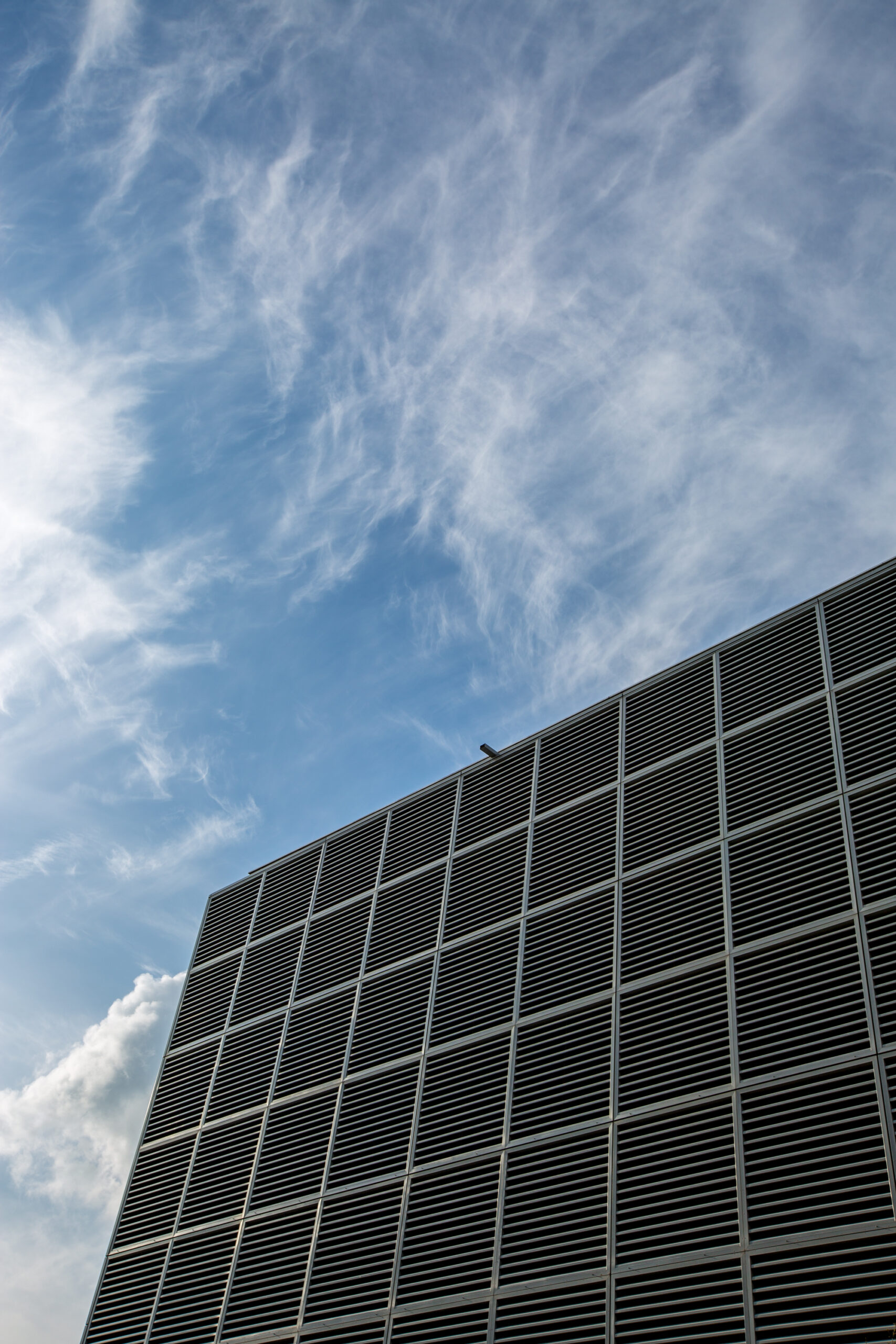 low-angle-view-modern-building-against-sky-scaled.jpg