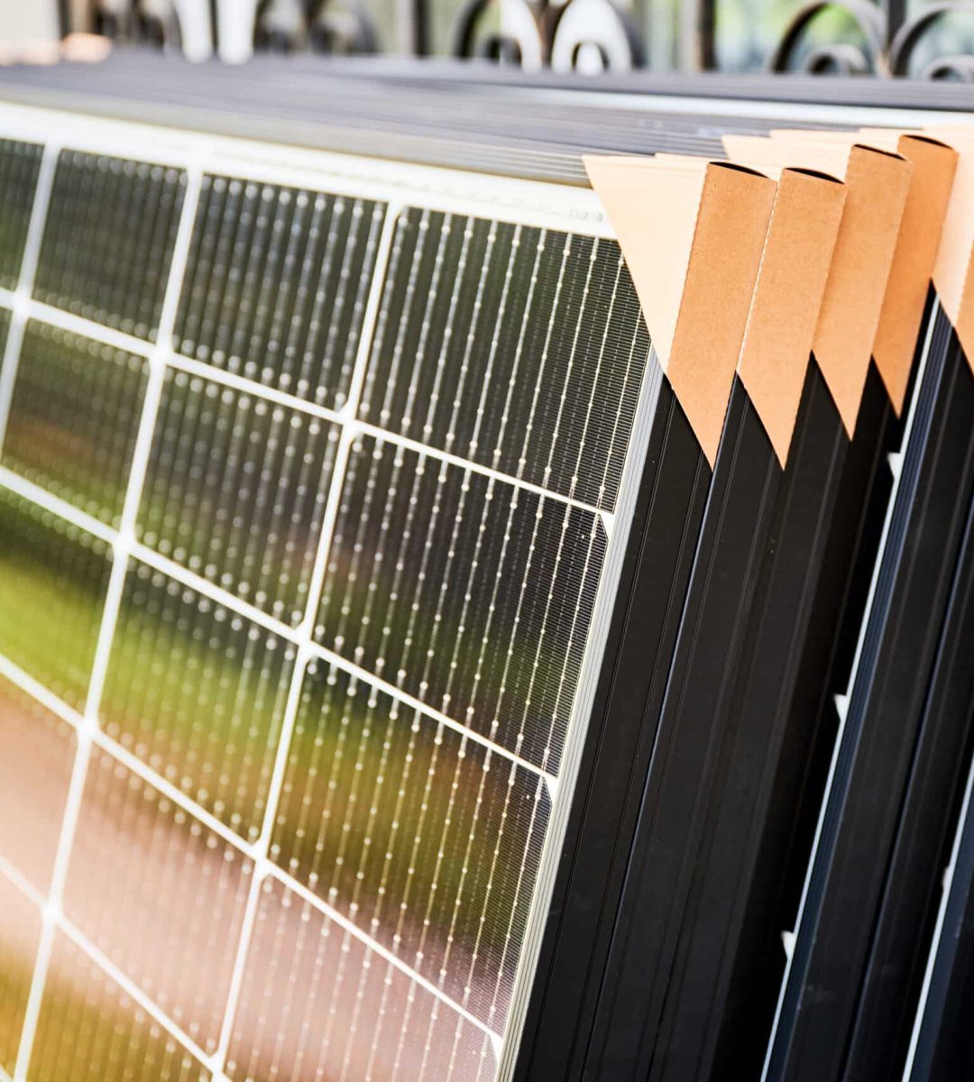 close-up-new-solar-panels-with-protective-cardboar-2024-01-31-17-19-44-utc-scaled.jpg